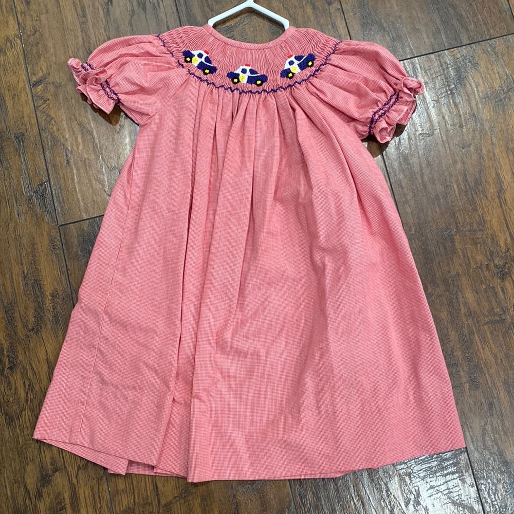 Red smocked police dress. Long dress